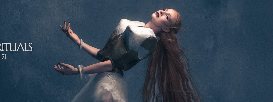 Vera Blue, Rituals at The Gov! - Vera Blue performs on stage, bathed in blue and amber stage lighting, with outstretched arms during a live show.