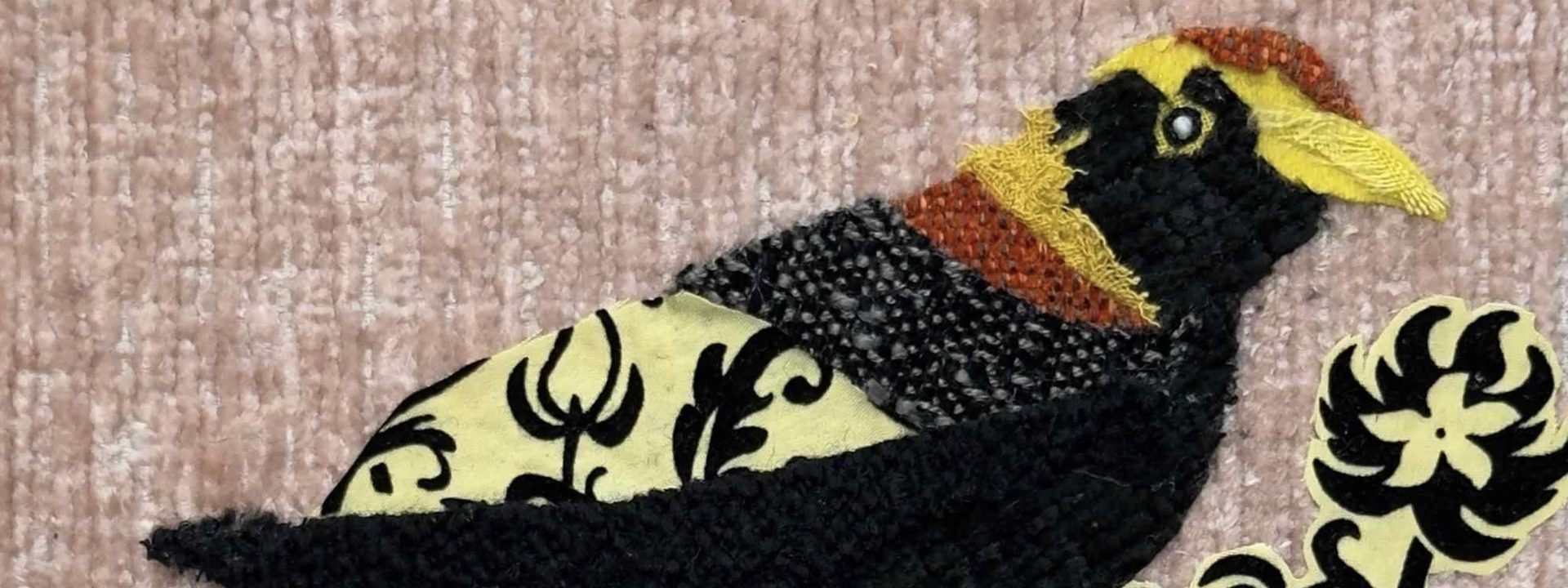 Oscar Arrais - Black and gold decorative bird perched on a branch with stylised floral motifs.