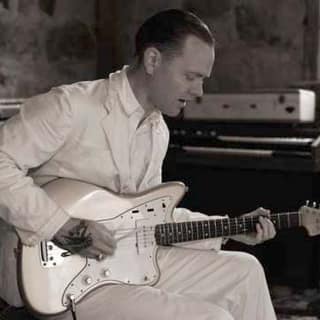 C.W. Stoneking locks into a groove on electric guitar in the studio.