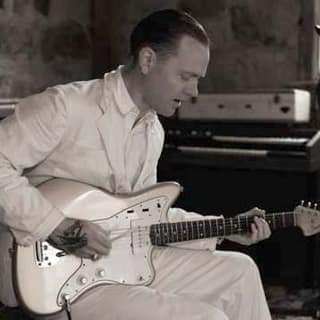 C.W. Stoneking locks into a groove on electric guitar in the studio.