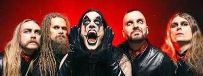 Avatar show demonstrates why Lion Arts Factory matters for Adelaide's heavier acts - Five musicians in dark clothing posed against a dramatic red-lit backdrop, with the centre figure's mouth open in an intense expression.
