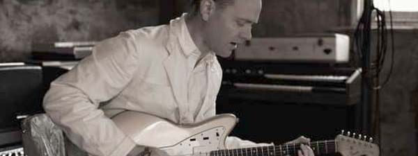 C.W. Stoneking locks into a groove on electric guitar in the studio.
