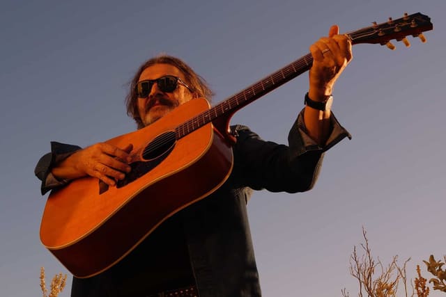 Dom Mariani steps out of his heavy blues rock and boogie shoes and dusts off his 12-string electric on his new solo single, Jangleland.