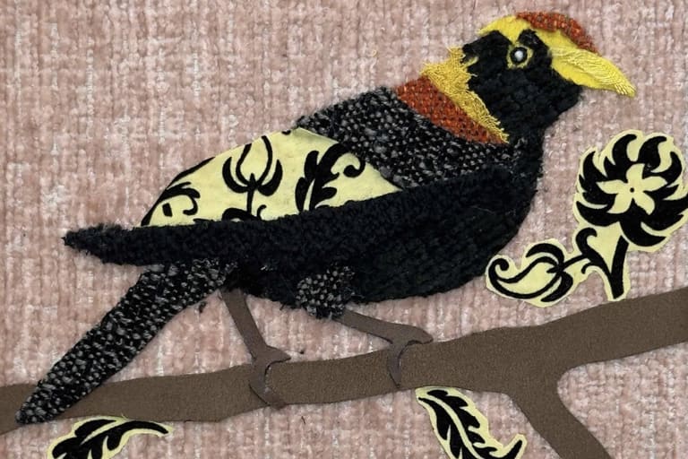 Oscar Arrais - Black and gold decorative bird perched on a branch with stylised floral motifs.