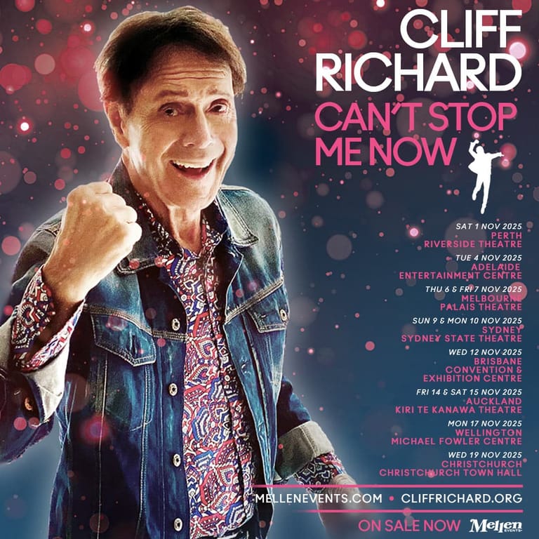 Cliff Richard smiles at camera in denim jacket and patterned shirt against pink bokeh backdrop, promoting "Can't Stop Me Now" tour.
