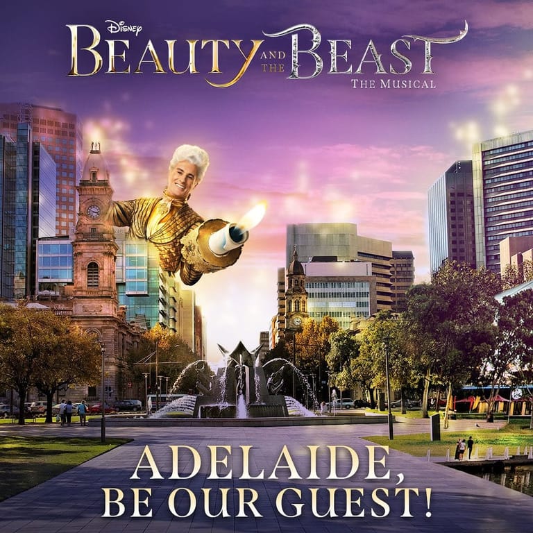 Disney's Beauty and the Beast musical promotional image featuring a golden statue in an Adelaide park at dusk.