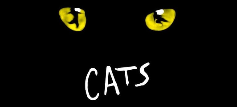 Two glowing yellow cat eyes and white "CATS" text against a black background.