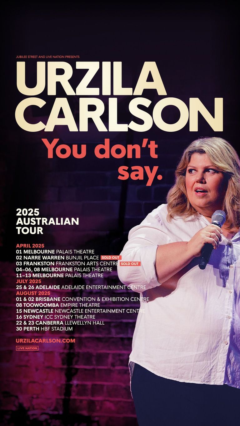 Blonde woman in white shirt holding microphone against dark stage background, promotional poster for Urzila Carlson's 2025 Australian comedy tour.