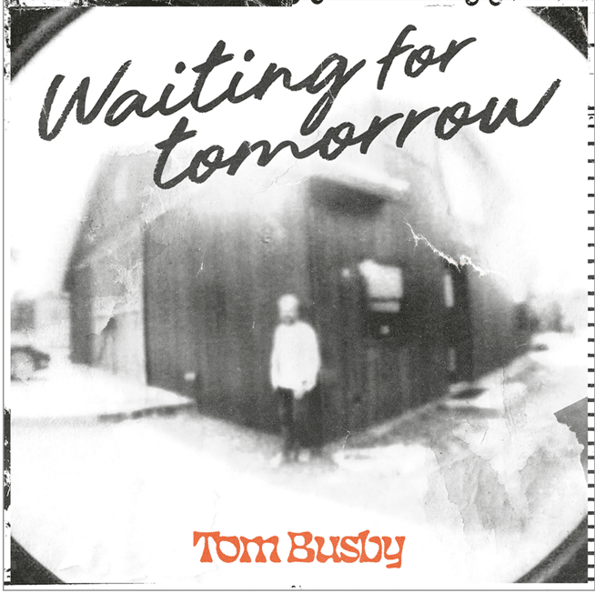 Black and white album cover for "Waiting for Tomorrow" by Tom Busby, featuring a solitary figure outside a modernist building.