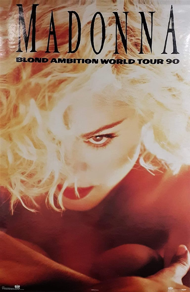 Blonde-haired performer with red eye makeup gazes downward on the Blonde Ambition World Tour 90 promotional poster.