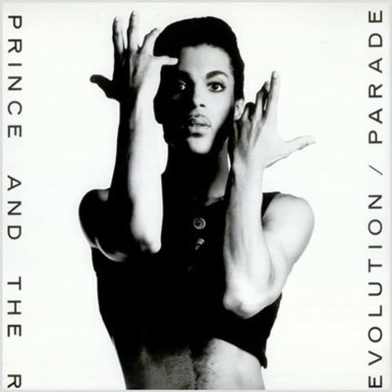 Black and white portrait of a person with hands raised expressively beside their face, text reading "Prince and the Revolution Parade" surrounding the image.