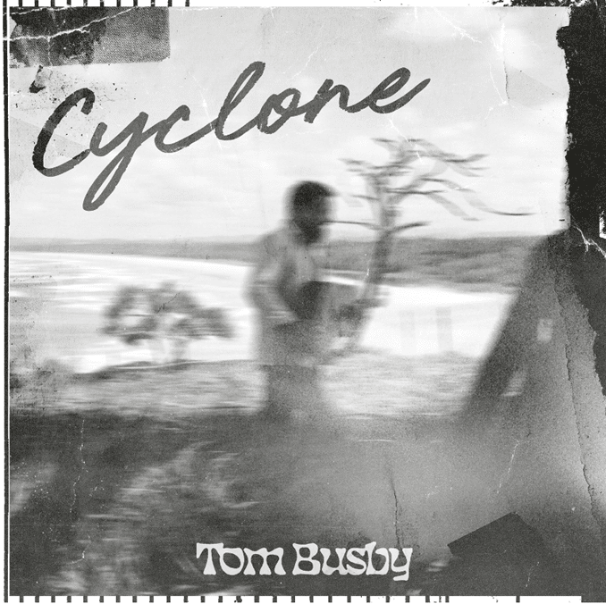 Blurred figure in motion beneath "Cyclone" text on grayscale album cover for Tom Busby.