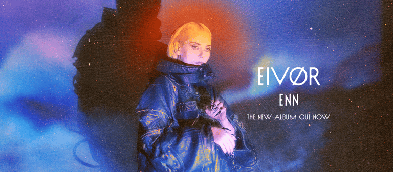Figure in iridescent jacket stands against glowing blue and red atmospheric lighting with album text overlay.