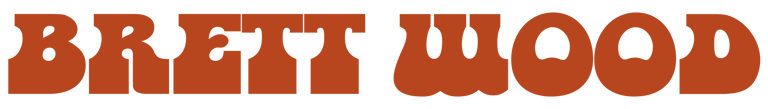 Brett Wood's name in large orange block letters on a plain background.