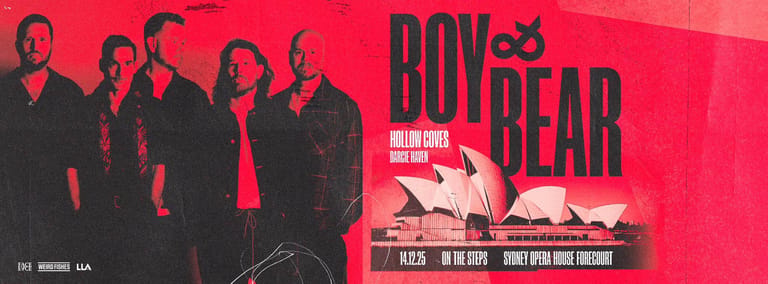 Five performers in dark clothing stand against a bright red promotional poster for Boys of the Bear theatre production.