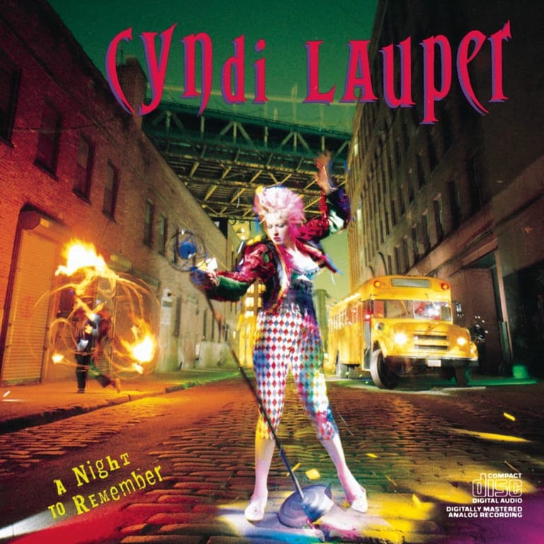 Stylised figure in purple and white checkered outfit posed on neon-lit urban street set with illuminated signage and retro vehicle.