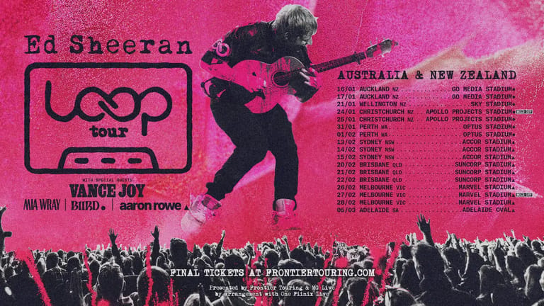 Guitarist performing mid-leap against bright pink backdrop with tour dates and silhouetted crowd below.