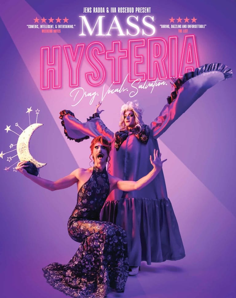 Three performers in shimmering purple and black costumes pose dramatically against a purple background with crescent moon and star props.