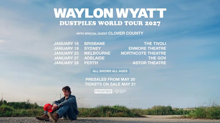 Waylon Wyatt sits outdoors holding a red guitar case, with tour dates and venues listed above against a blue sky.