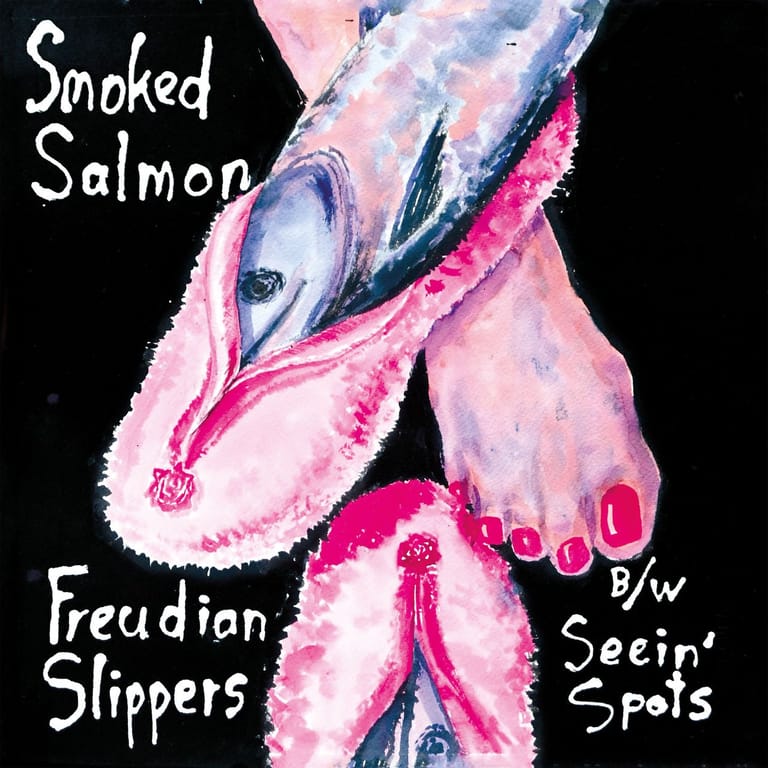 Close-up of painted feet in pink and magenta slippers against a black background with white handwritten text.