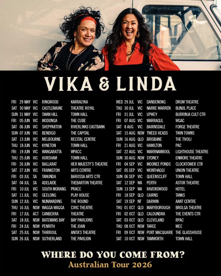 Two women smile at the camera in front of a vintage caravan, with tour dates listed below for Vika & Linda's 2026 Australian theatre tour.