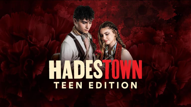 Two performers in classical costume stand against a deep red backdrop with "Hades Town Teen Edition" text overlay.