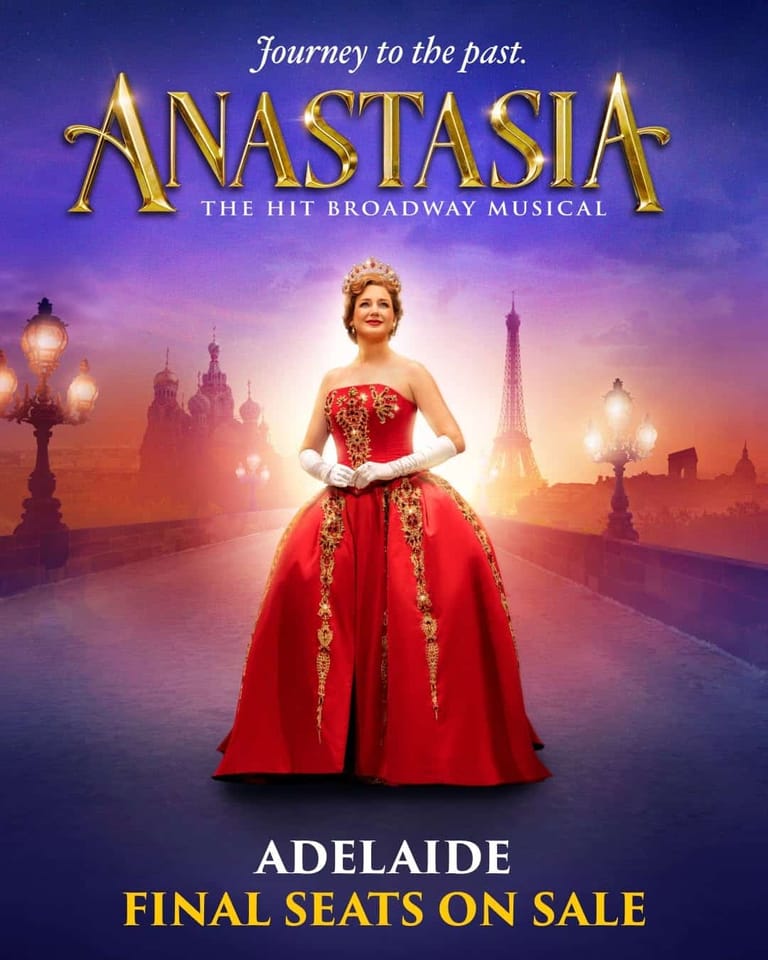 Performer in a red ball gown stands before a glowing St Petersburg skyline in promotional artwork for Anastasia musical.