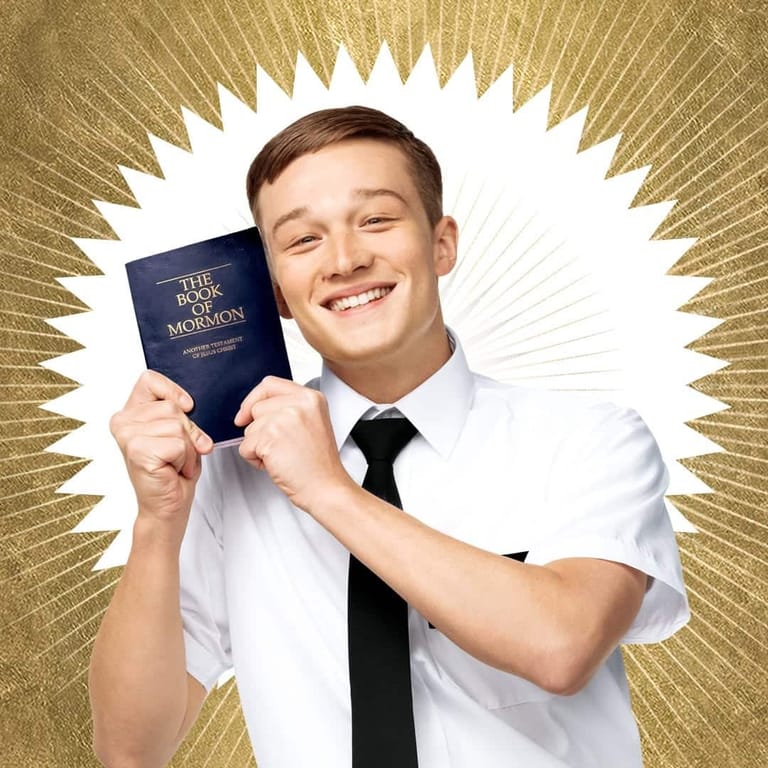 Young man in white shirt and black tie holding a blue book with gold halo effect against radiating gold background.
