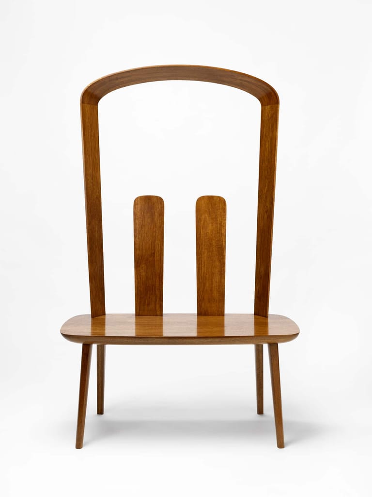 Wooden chair with high curved backrest and two vertical slats, rendered against a neutral background.