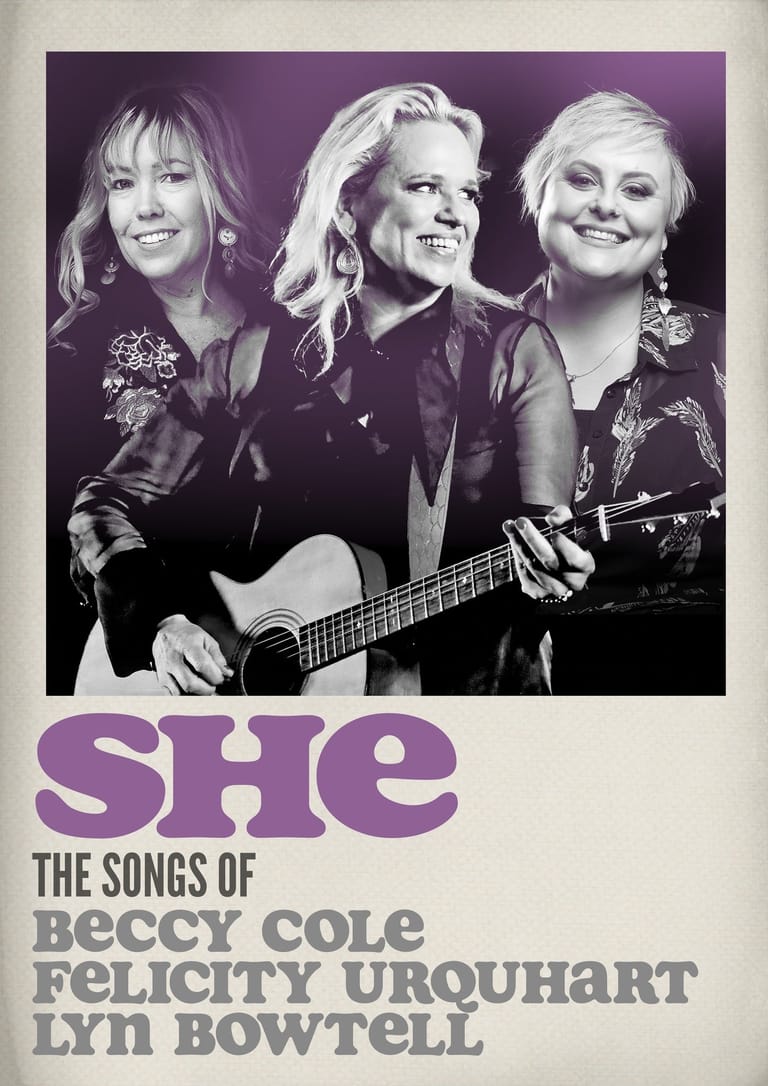 Three women with 1970s-style blonde hair pose together, one holding an acoustic guitar, against a purple-tinted background.