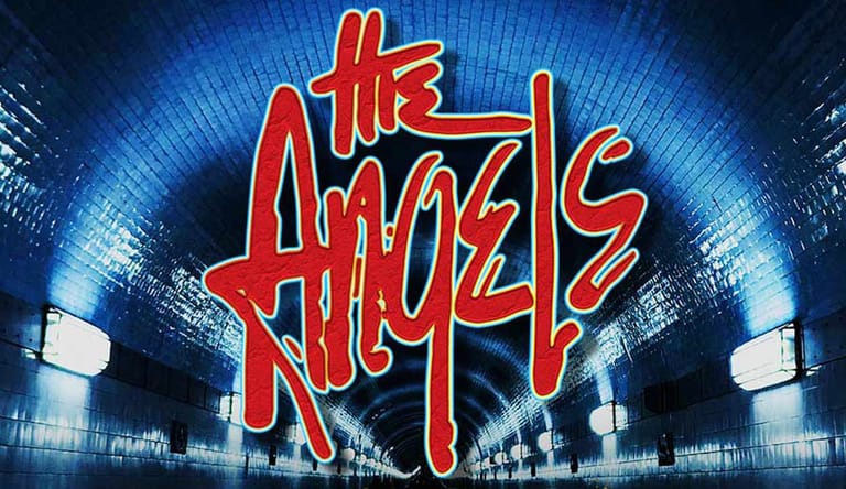 The Angels band logo in red neon lettering against a blue-lit urban cityscape backdrop.