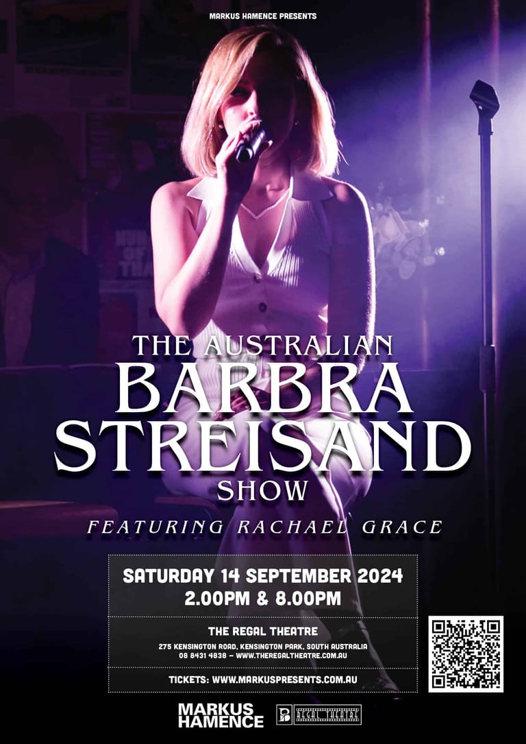 Singer holding microphone on stage, bathed in purple spotlight, during The Australian Barbra Streisand Show.