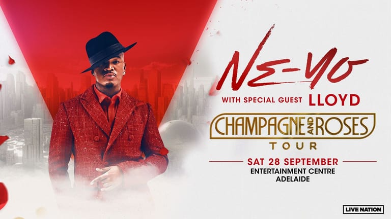 Ne-Yo in a red suit and fedora against a red-tinted cityscape backdrop for the Champagne and Roses Tour.