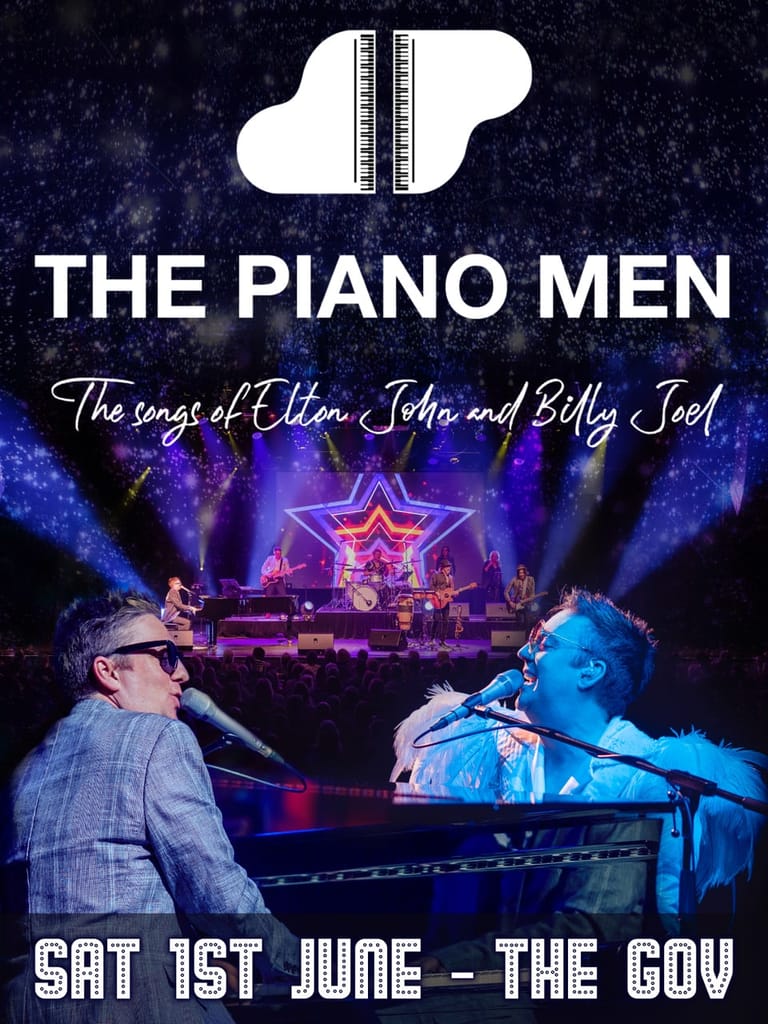 Two musicians perform at pianos on stage under purple and blue lighting, with a star-shaped backdrop behind them.