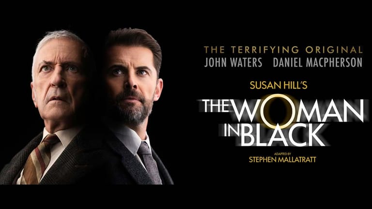 Two men in formal attire face the camera against a dark background with film title and cast names displayed.