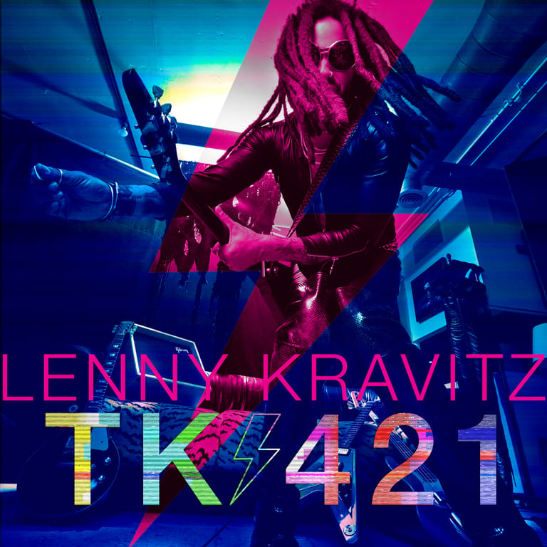 Performer illuminated in magenta and blue stage lighting with geometric set design, text reading "LENNY KRAVITZ TK421" overlaid.