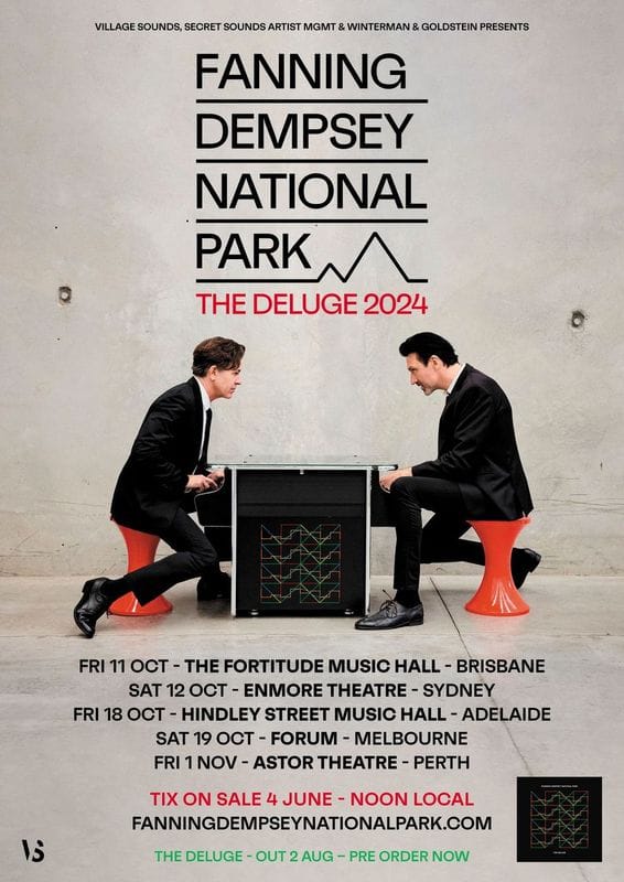 Two people in black suits crouch beside a glowing electronic device against a white wall during The Deluge 2024 tour promotion.
