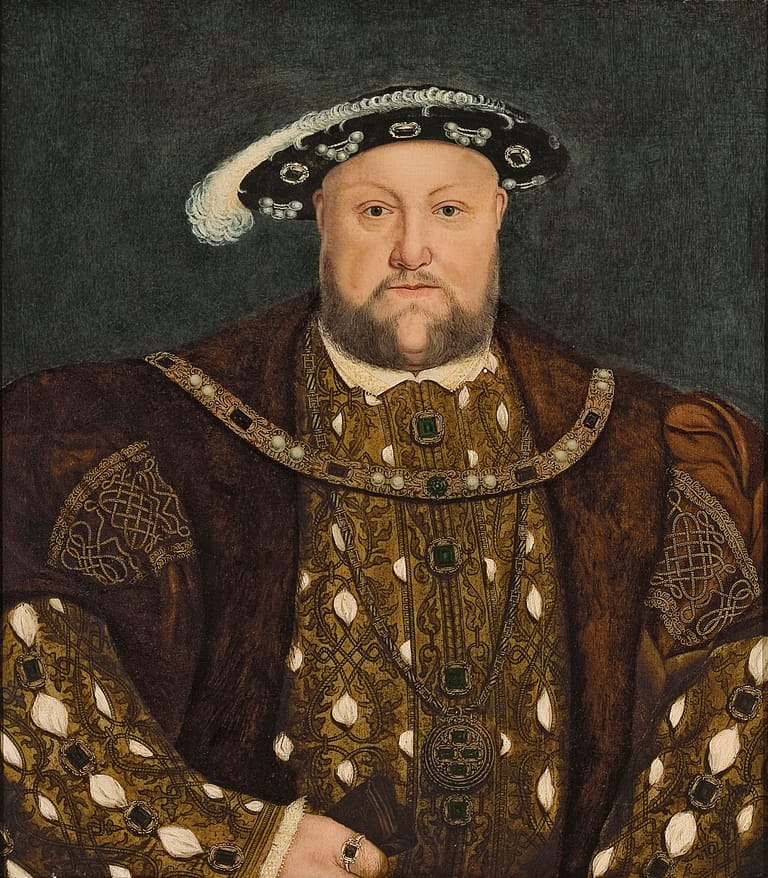 Portrait of a bearded man wearing an ornate jewelled doublet, feathered hat and fur-trimmed coat against a grey background.