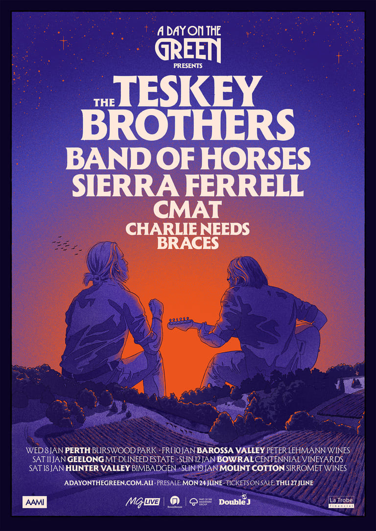 Two musicians silhouetted against a purple and orange sunset sky at A Day on the Green festival.