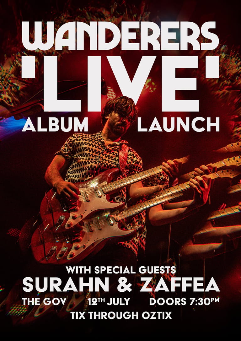 Guitarist in leopard-print shirt performing under warm stage lighting at Wanderers live album launch event.
