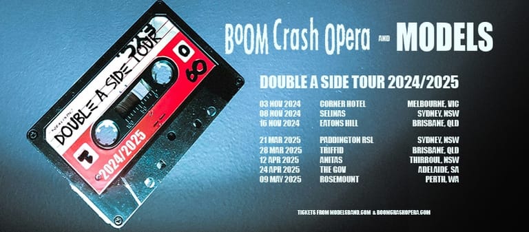 Red and white cassette tape displayed against blue background with "BOOM Crash Opera – MODELS" tour text and dates listed.
