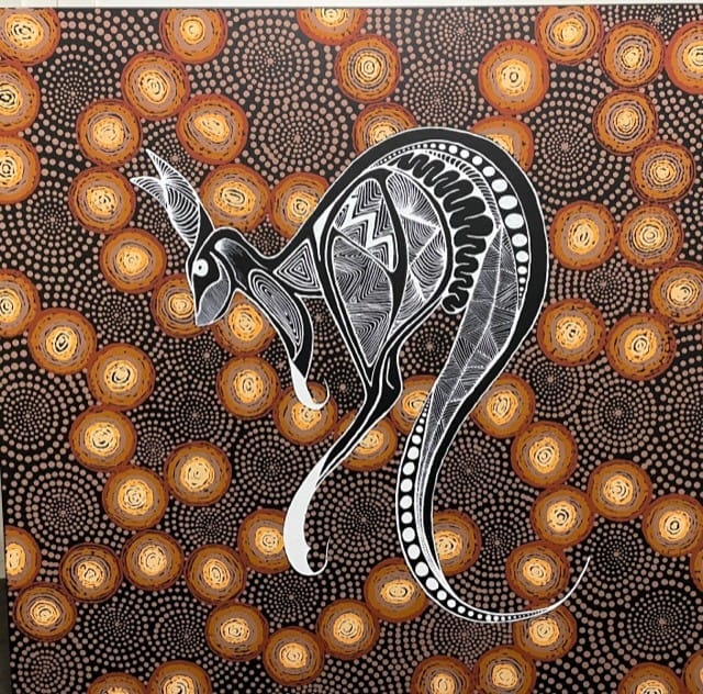 Aboriginal dot painting featuring a stylised snake in black and white against dotted ochre and brown background.
