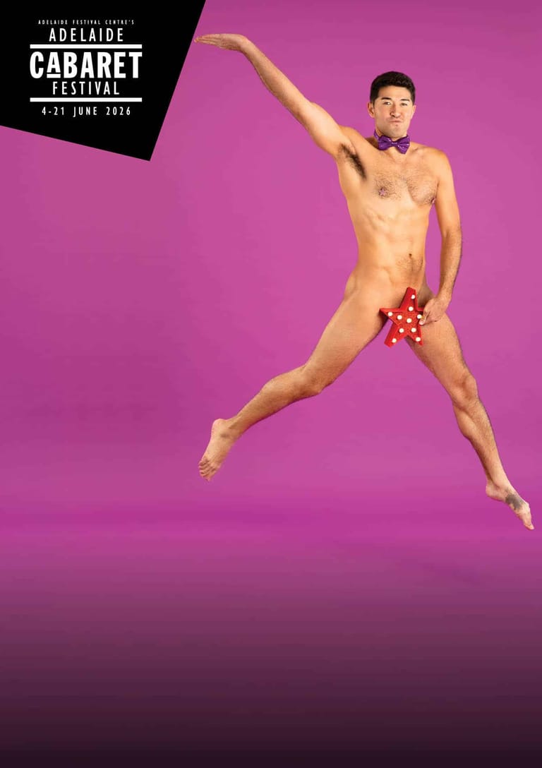 Performer posed mid-leap against a vibrant magenta background at Adelaide Cabaret Festival.