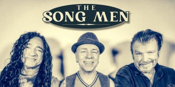 Three male performers smiling at the camera beneath "The Song Men" title banner.