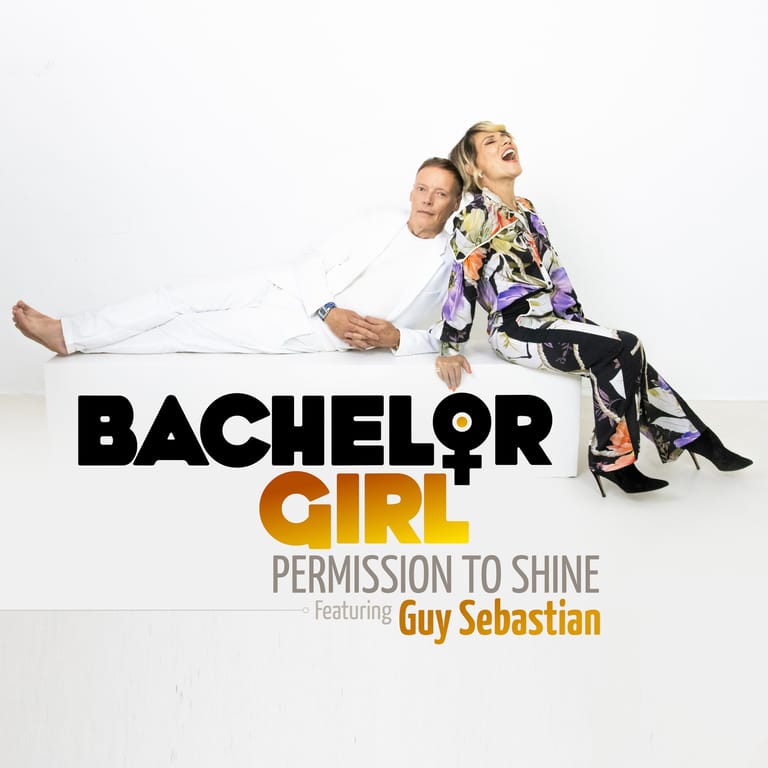Two performers pose playfully against a white background for Bachelor Girl's new music release "Permission to Shine".