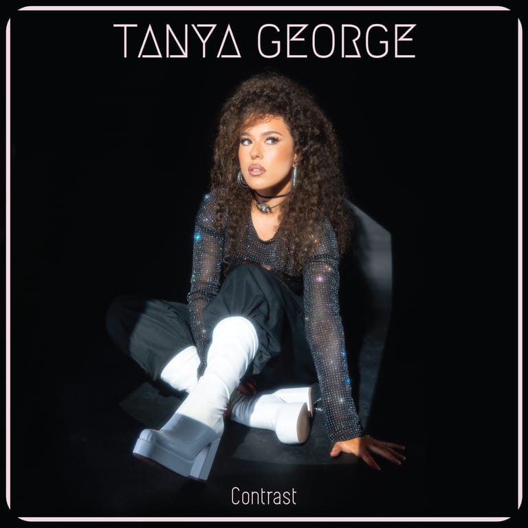 Tanya George sits against a black background wearing a dark jacket and white gloves, album cover for Contrast.