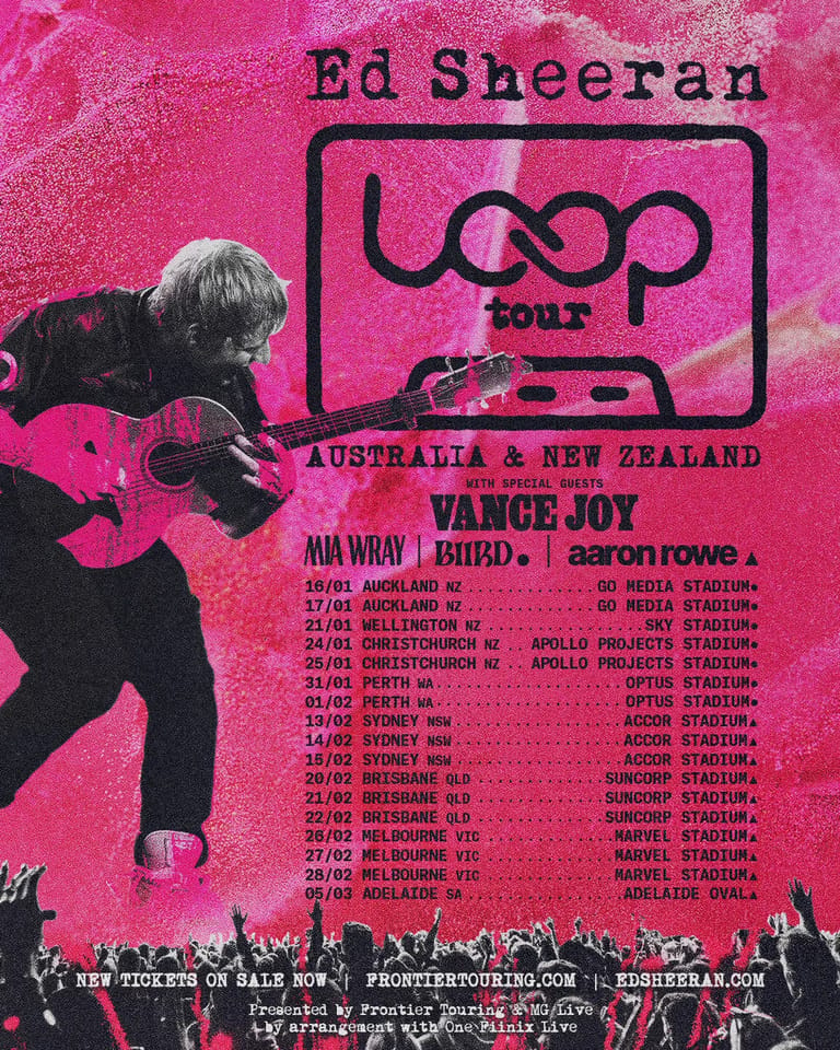 Musician playing acoustic guitar against bright pink tour poster for Ed Sheeran's loop tour across Australia and New Zealand.