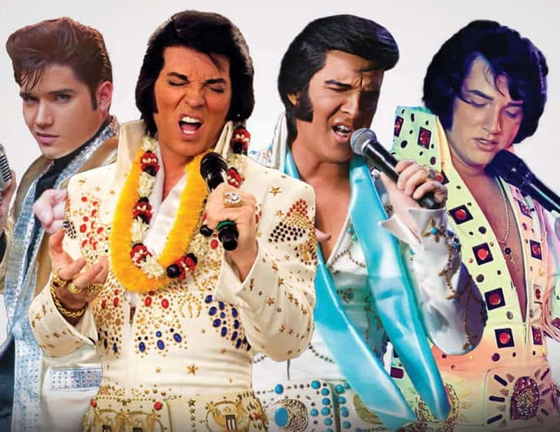 Four Elvis tribute performers in signature jumpsuits and jewellery pose together at Adelaide International Elvis Festival 2024.