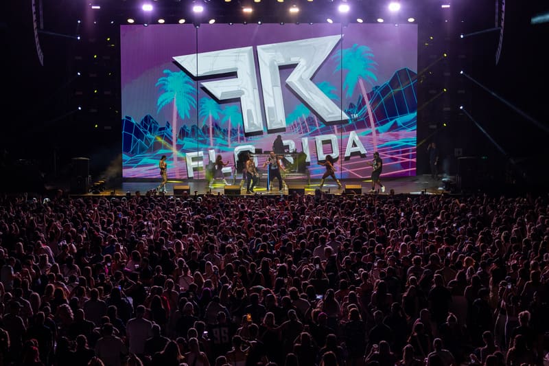 Large crowd facing an illuminated stage displaying the FTK Fridayz Live logo beneath purple and blue lighting.